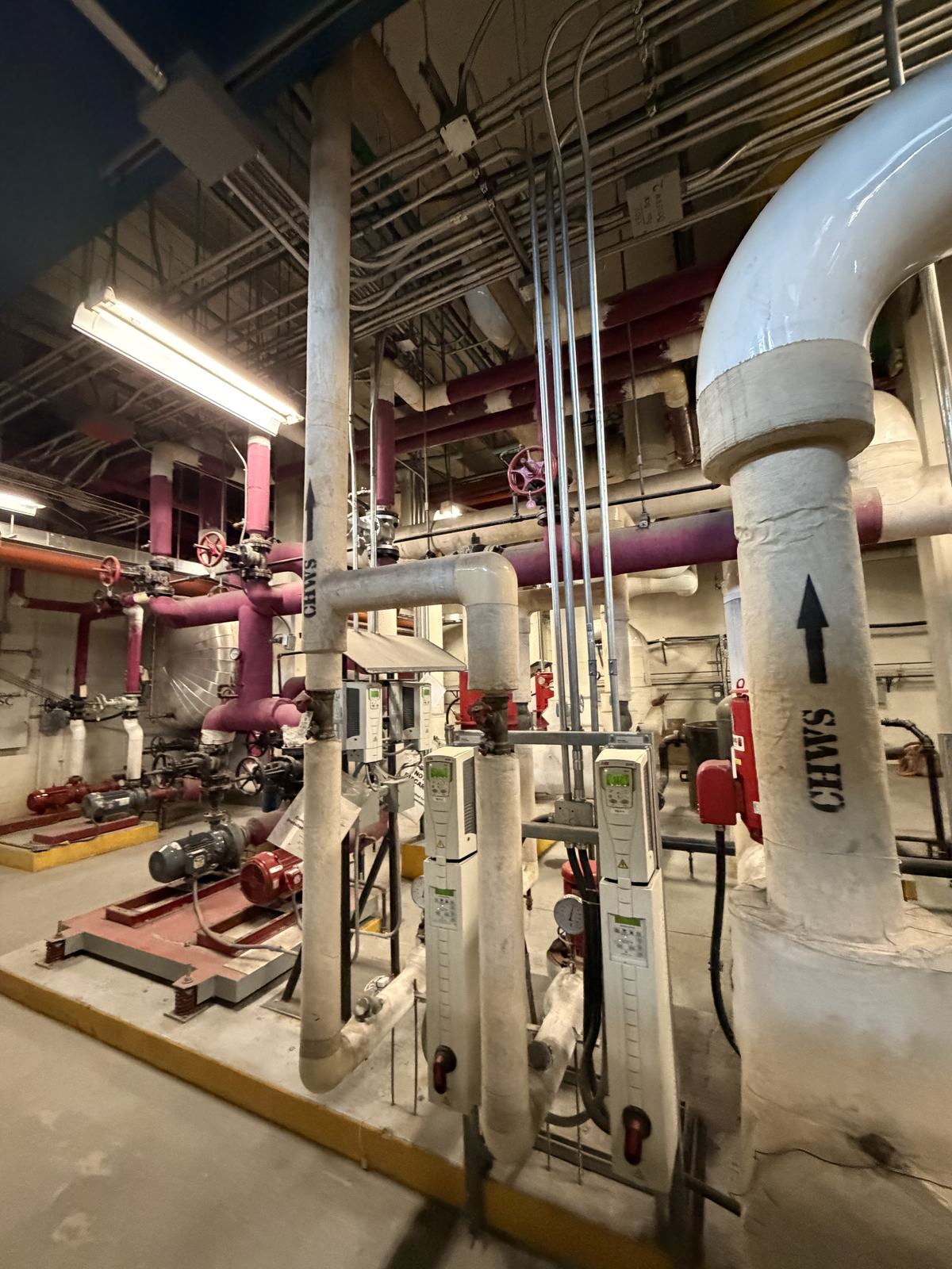 Mechanical room with chilled water headers and distribution pumps