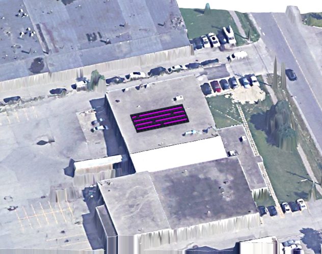 Aerial view of 250 Midwest Road with the modelled photovoltaic array placement overlaid in magenta on a single roof section